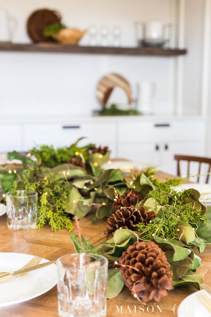 magnolia leaves, pinecones, and cedar centerpiece | Maison de Pax