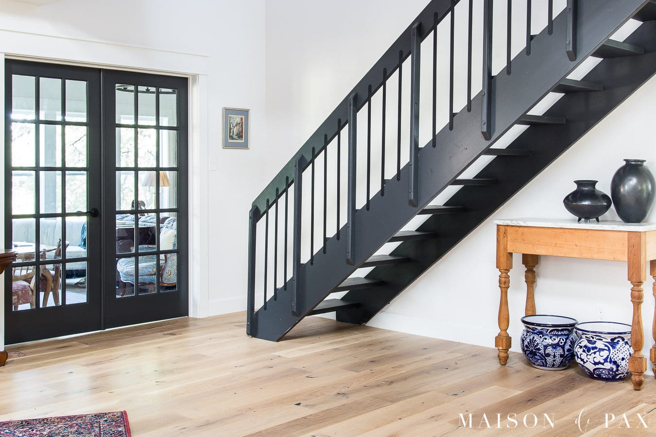iron ore french doors at base of stairs