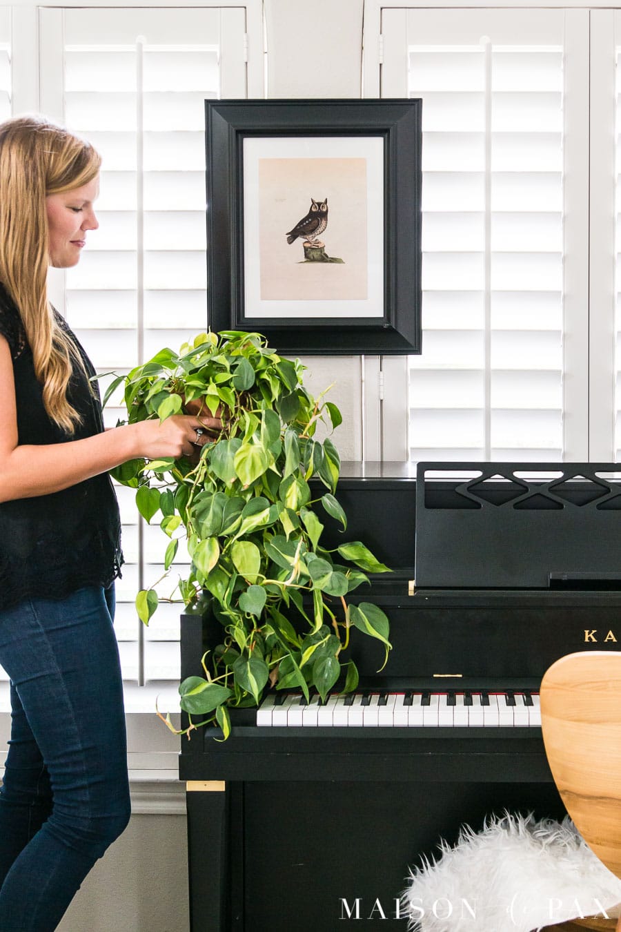 Philodendron and vintage art above piano | Maison de Pax