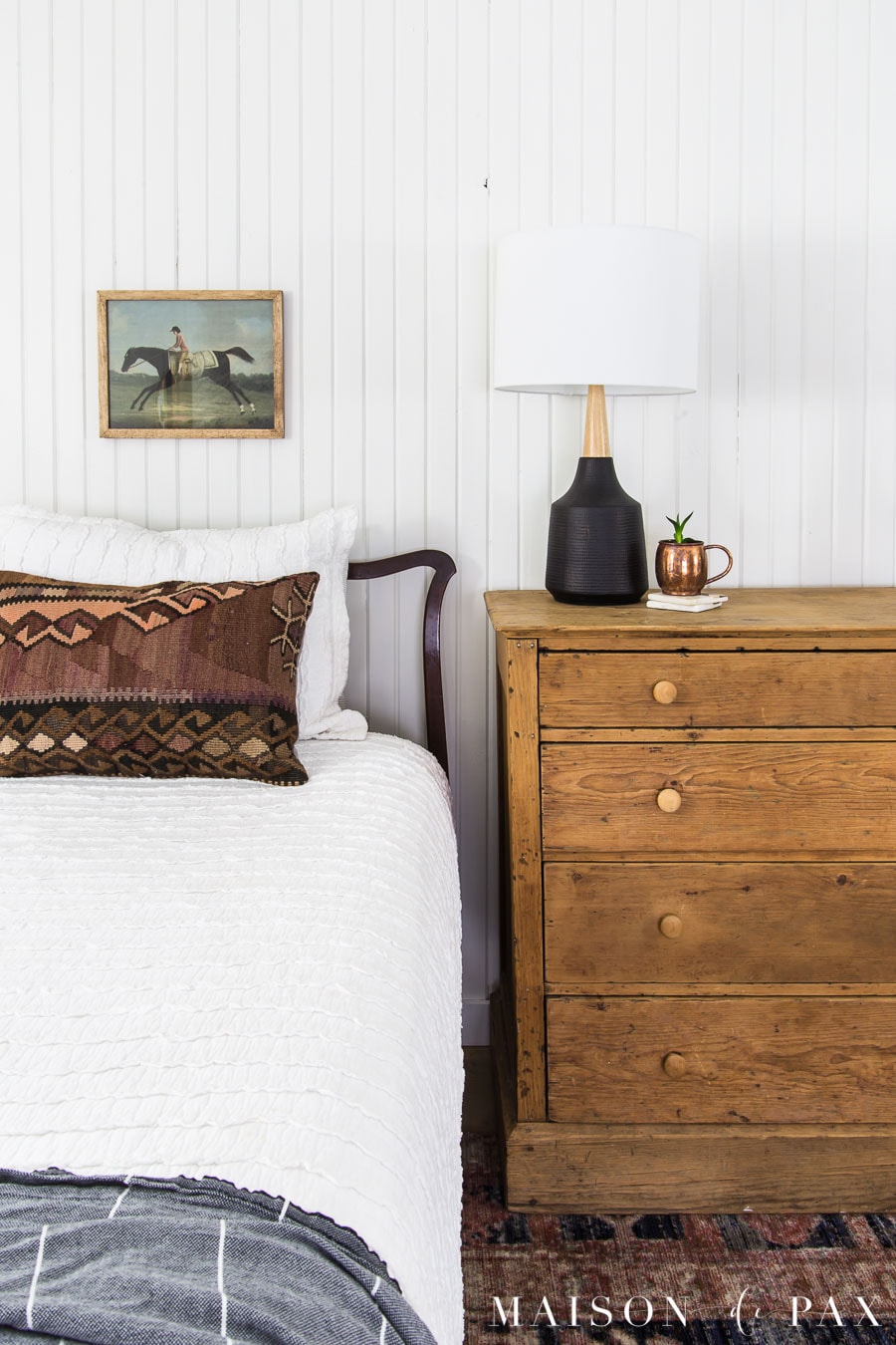 vintage art above antique bed in white farmhouse bedroom | Maison de Pax