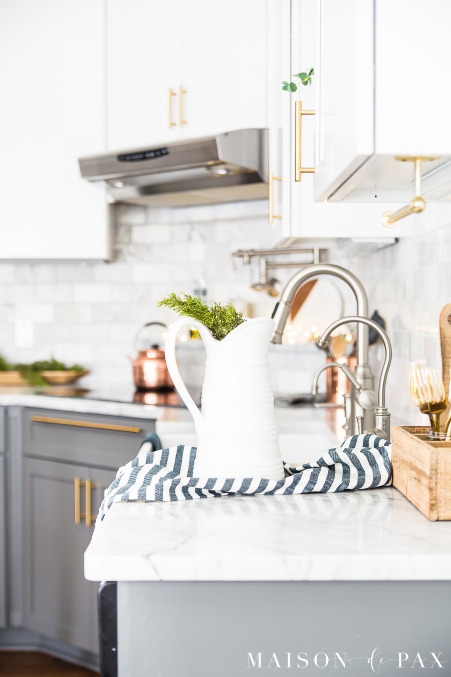 christmas kitchen decor: white farmhouse pitcher with fresh cedar clippings- Maison de Pax