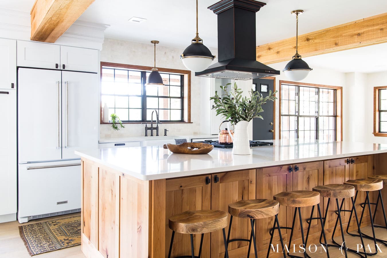 giant wood island in kitchen with barstools | Maison de Pax
