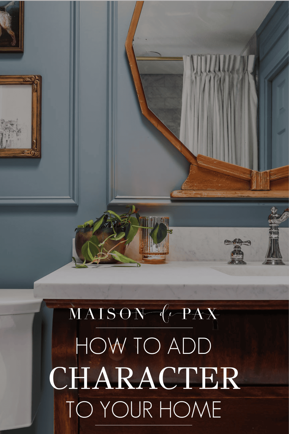 image of bathroom with antique wood vanity and blue walls with picture frame molding