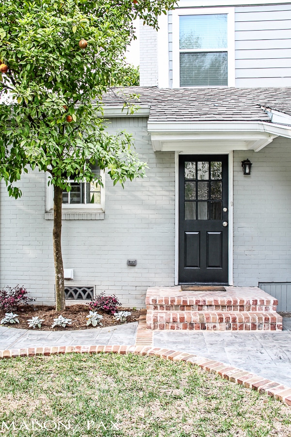 gray house with brick steps and black door | aiweb9ygdry.cmersite.com