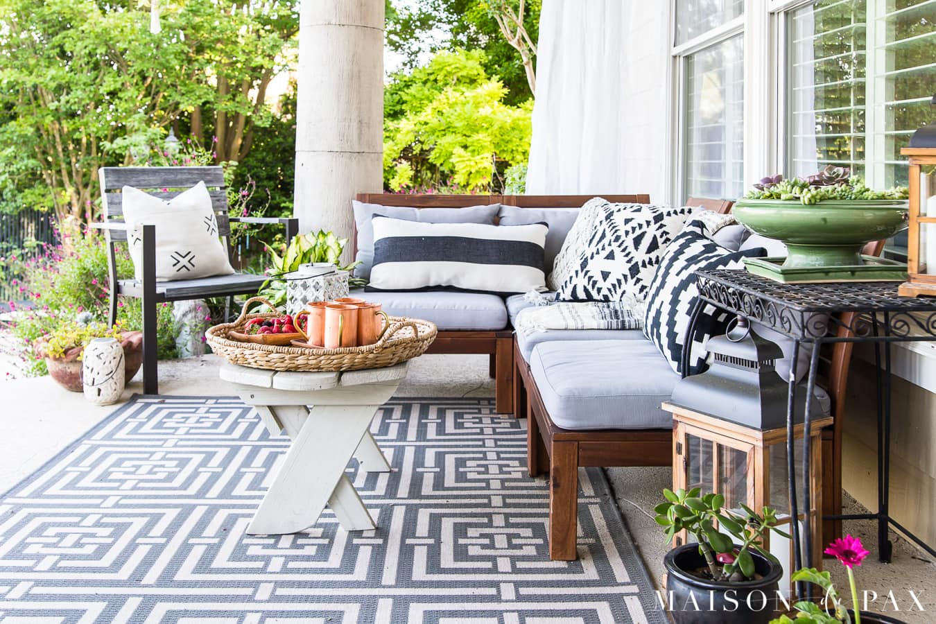 black and white porch with gray sectional- Maison de Pax