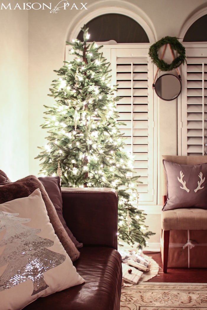 holiday decorating: christmas tree with white lights and mercury glass, antler pillow, wreath, sequin tree pillow
