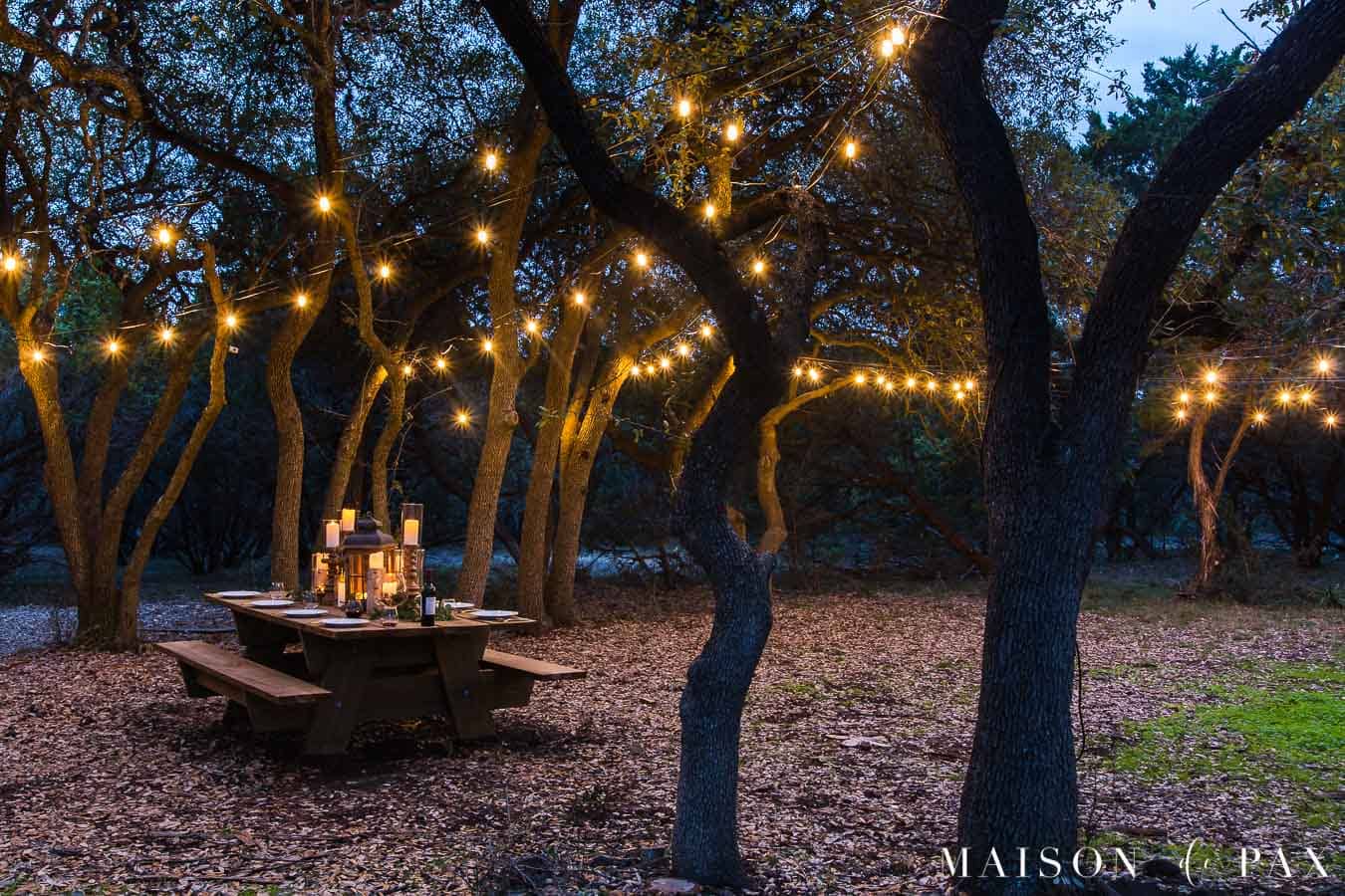 globe lights strung over outdoor patio area | maison de pax