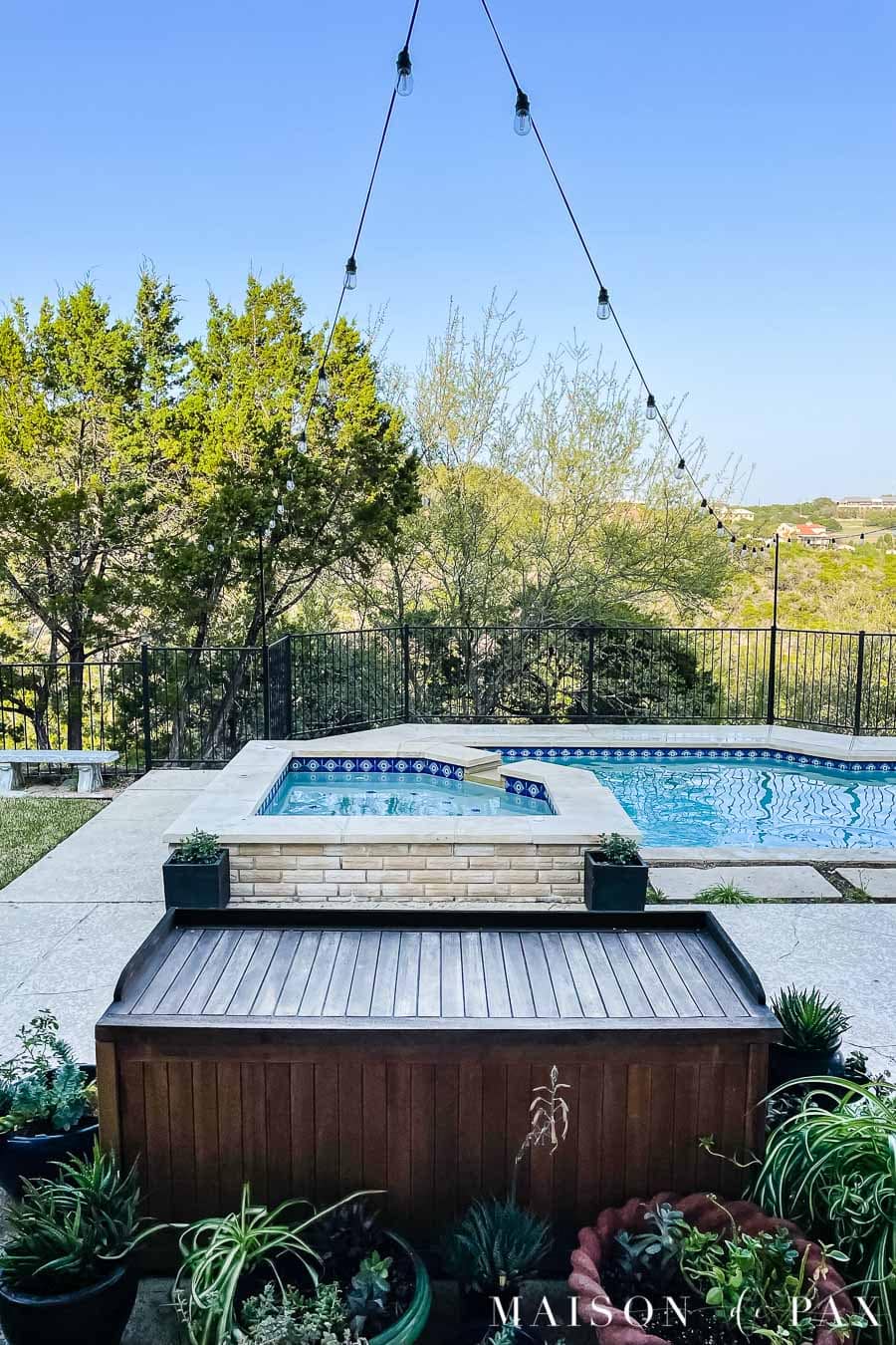 outdoor string lights over patio and pool