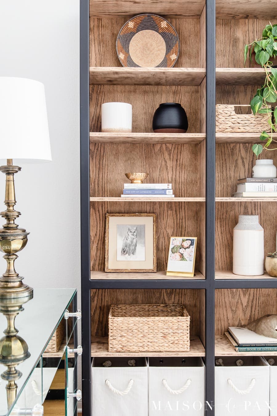black styled bookcase with light wood inside