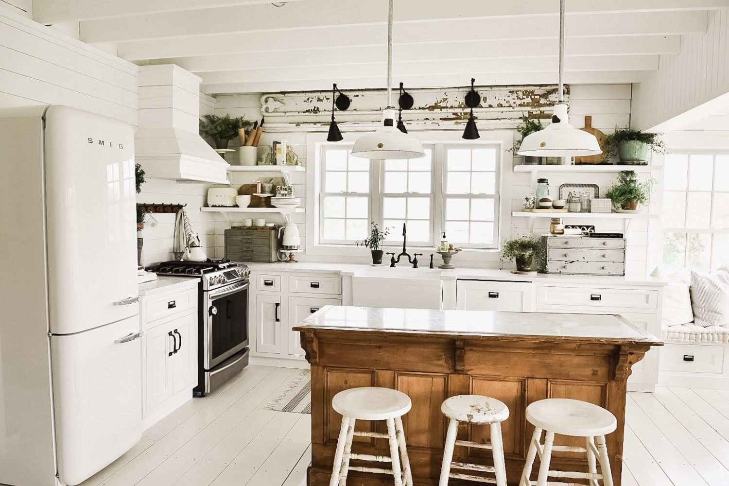 Liz Marie Blog kitchen: rustic antique wood island amidst white cabinetry-  Maison de Pax