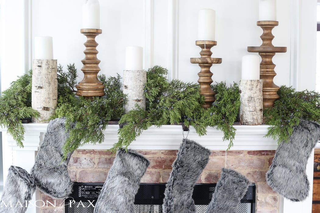 Winter Woodland Christmas Mantel: Looking for mantel decorating ideas? Some fresh cut cedar, candlesticks, and a faux deer mount creates the perfect holiday decor.