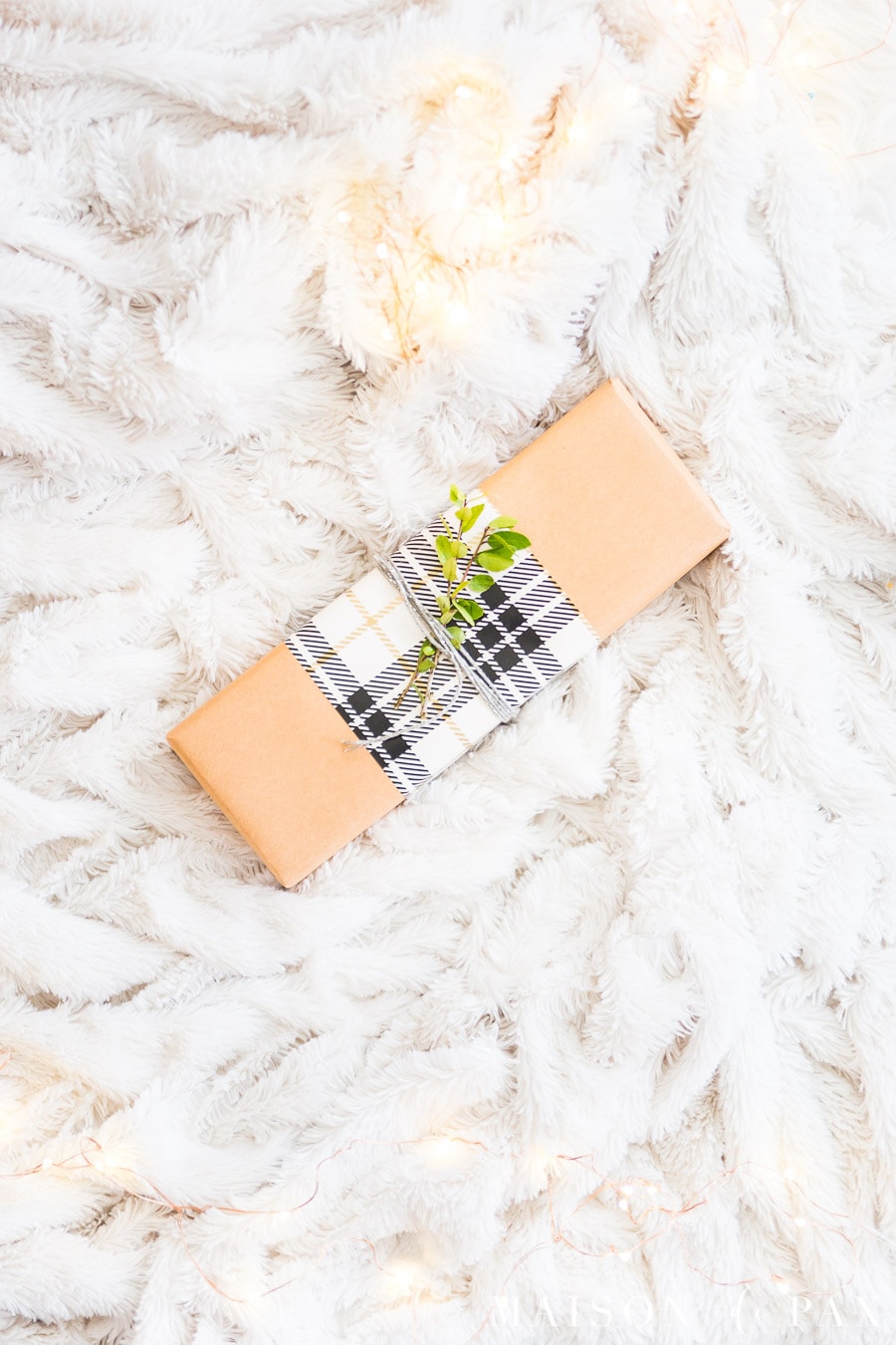brown paper package with white plaid ribbon | Maison de Pax
