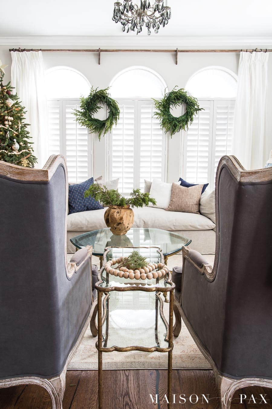 simple pine wreaths hung on windows