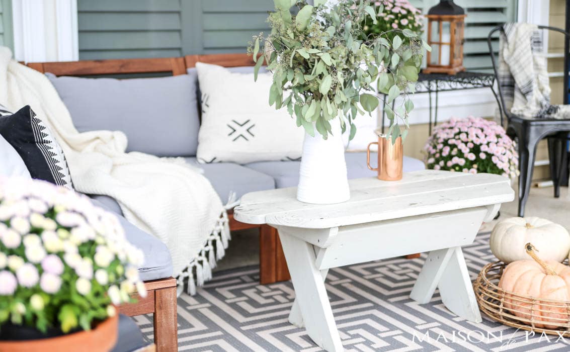 neutral pillows and pastel pumpkins make a cozy fall porch- Maison de Pax