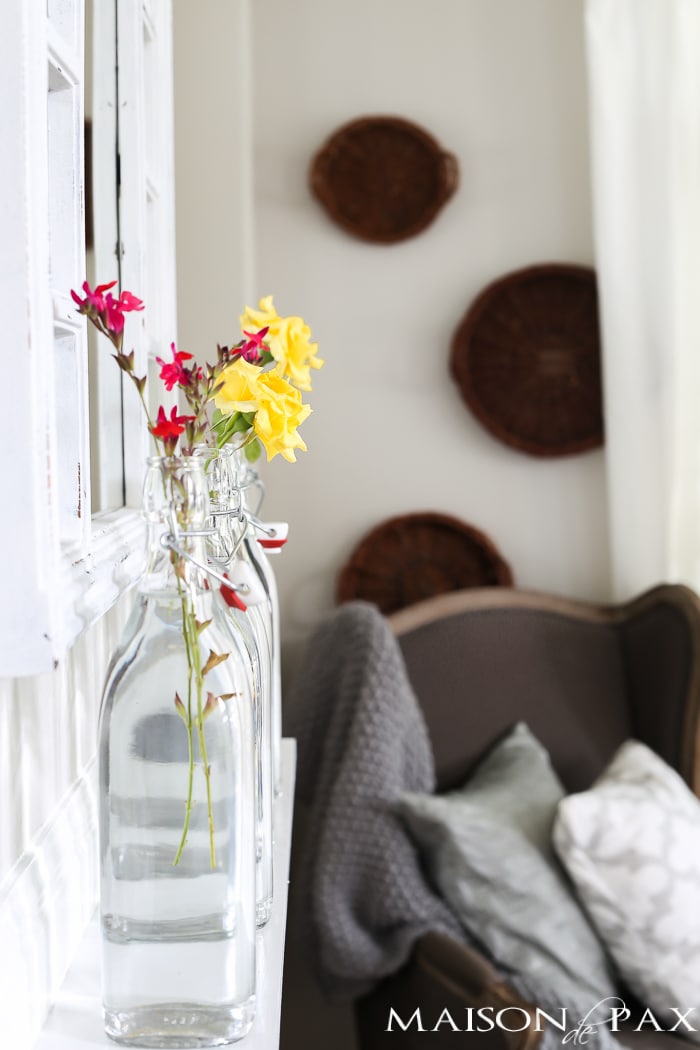 simple glass bottles on the mantel | quick summer decorating ideas
