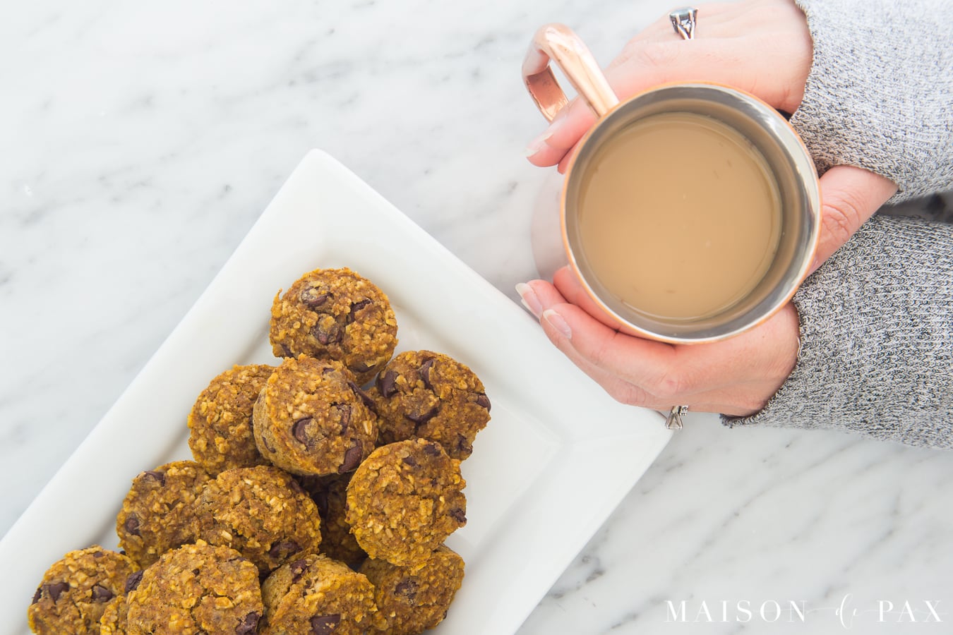 Gluten free pumpkin muffins: Made with applesauce and a touch of maple syrup for sweetening, oat flour, and pumpkin, these are packed with delicious flavor and nutritious ingredients #gf #glutenfree #pumpkinspice #fallrecipe #pumpkinrecipe #pumpkinmuffins #breakfast #gfbreakfast 