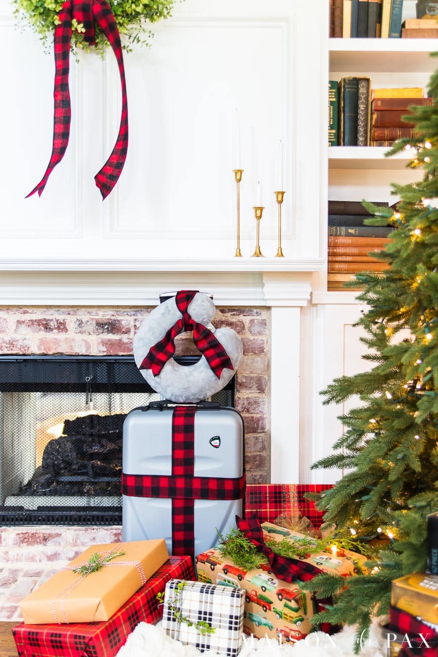 suitcase and neck pillow tied in a ribbon - perfect christmas gift idea | Maison de Pax