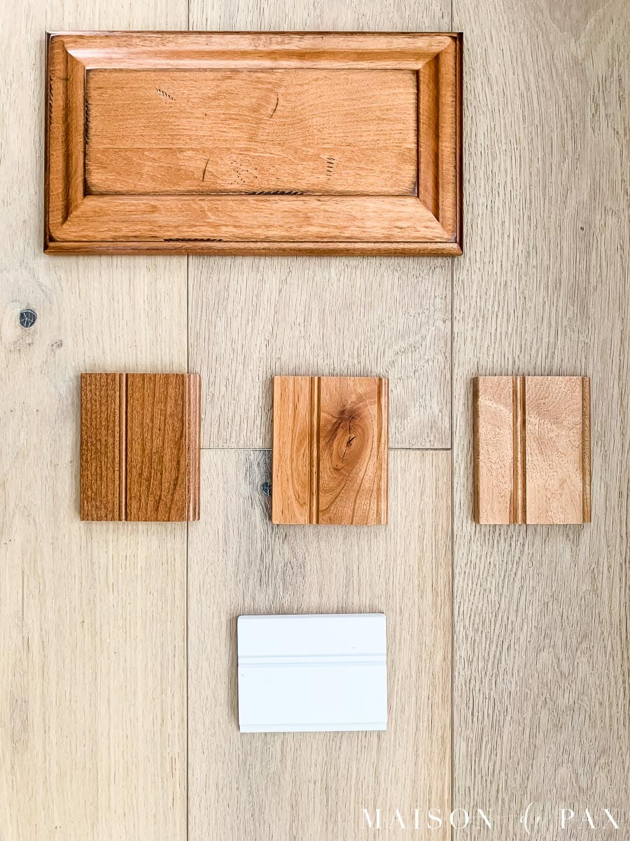 distressed maple praline cabinet door sample from KraftMaid, rustic alder ginger, rustic alder natural, and maple ginger laid side by side