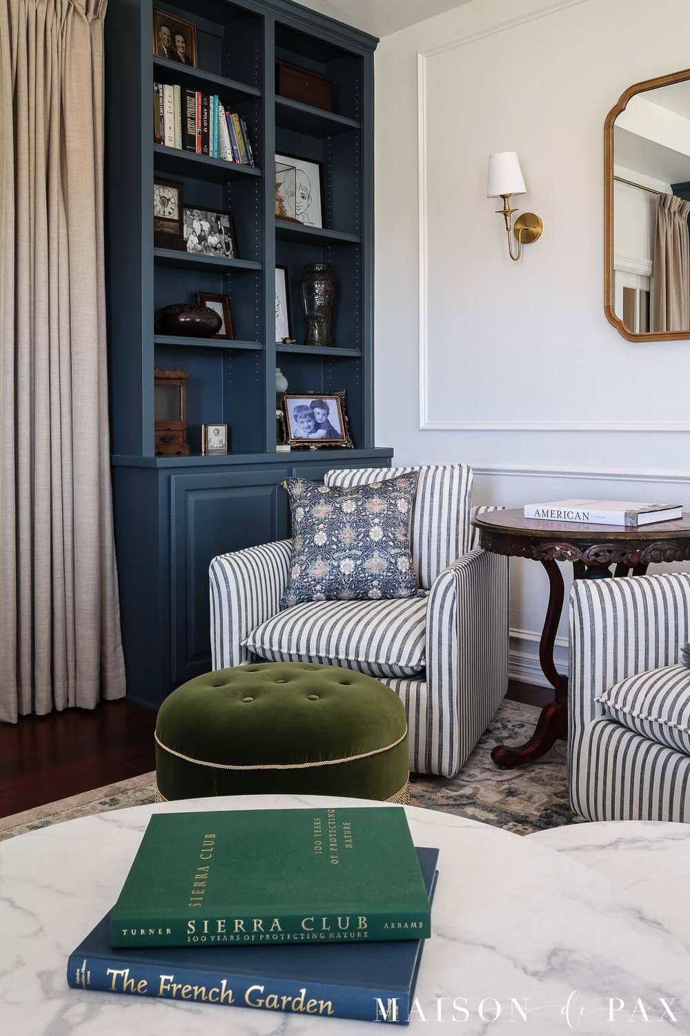 Elegant living room with dark blue bookcases painted sherwin williams rain cloud