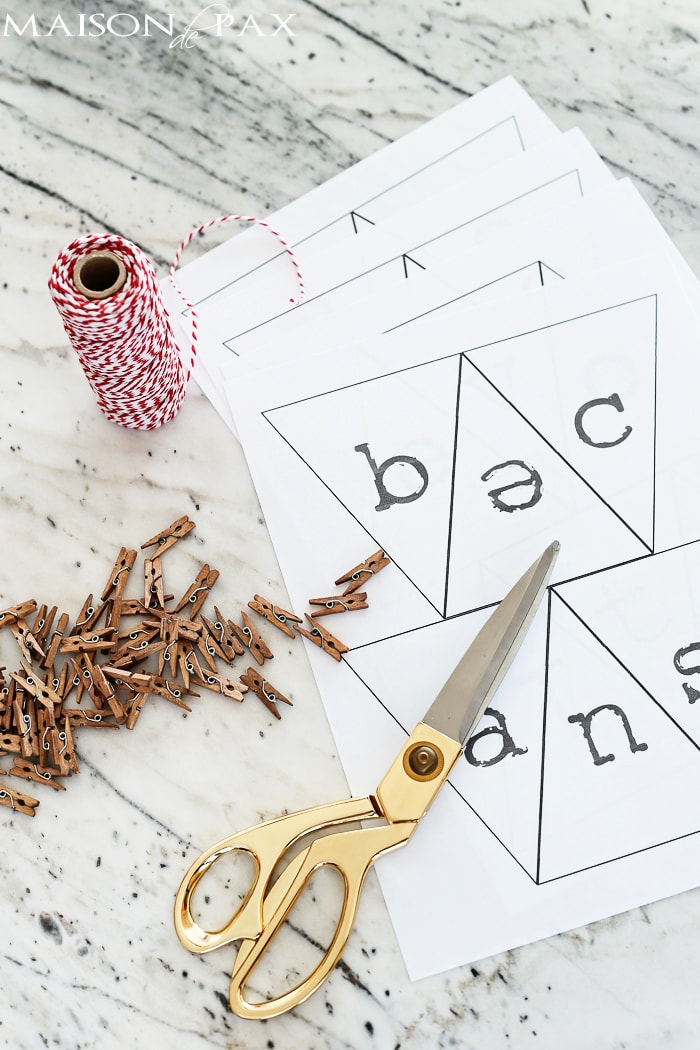 make a Valentine's day bunting from computer paper, baker's twine, and mini clothespins- Maison de Pax