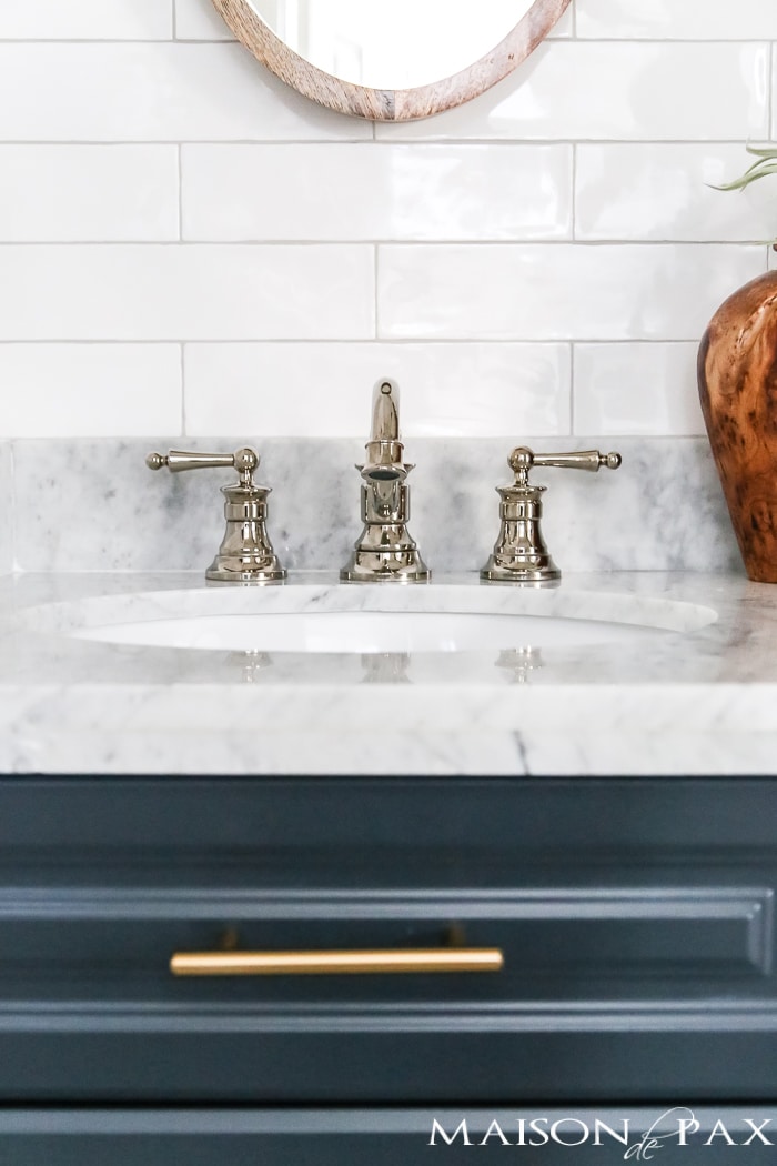polished nickel faucets are classic and timeless in this chick, modern bathroom - benjamin moore polo blue cabinets