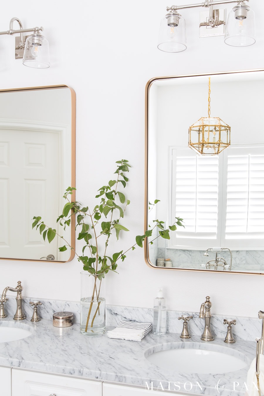 mixed metals in bathroom: gold mirrors with polished nickel faucets | Maison de Pax