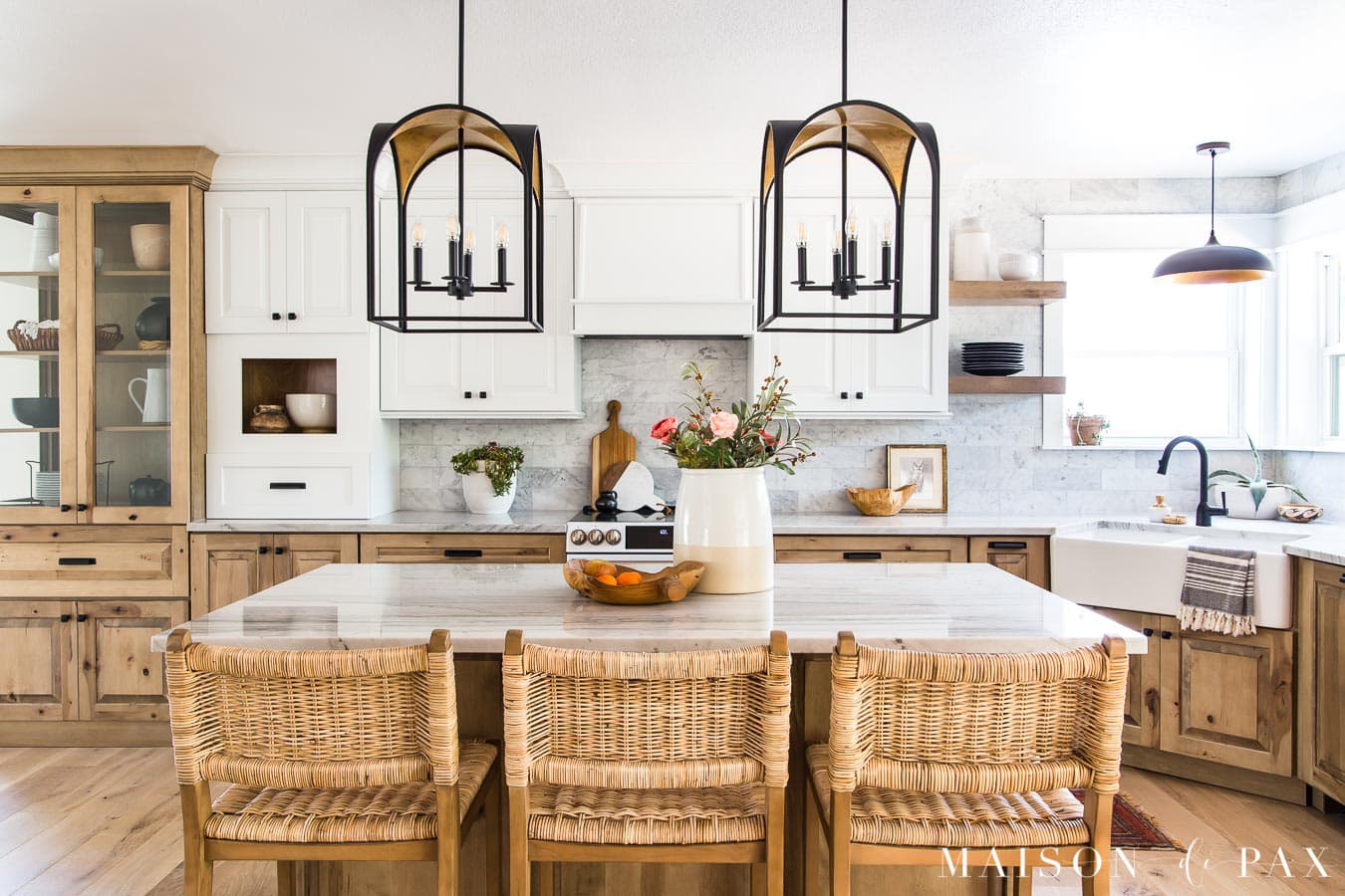 white and wood kitchen cabinets with large island