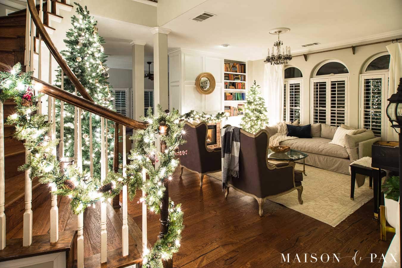 living room and stairwell lit by Christmas lights | Maison de Pax