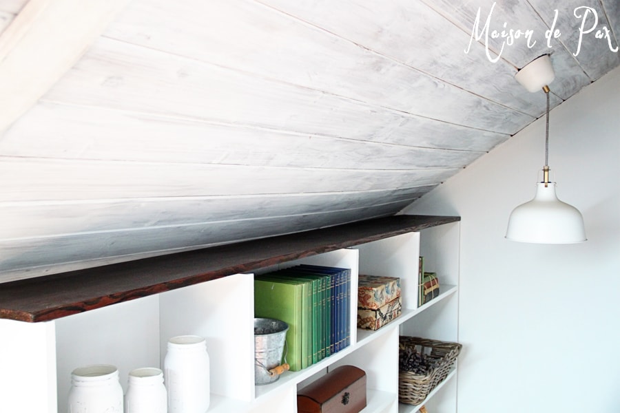 A DIY stairwell bookcase provides a creative and beautiful way to open the space and bring light into the stairwell.  Click through to see details and instructions!