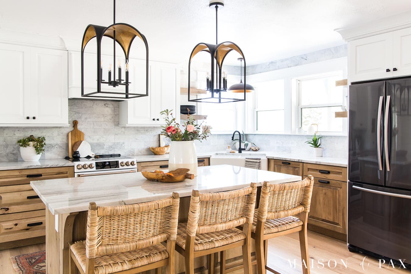 kitchen with island and white and wood cabinets