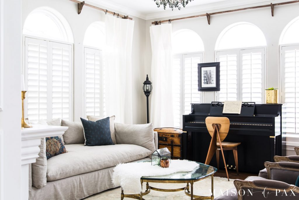 black mcm piano in transitional living room | Maison de Pax