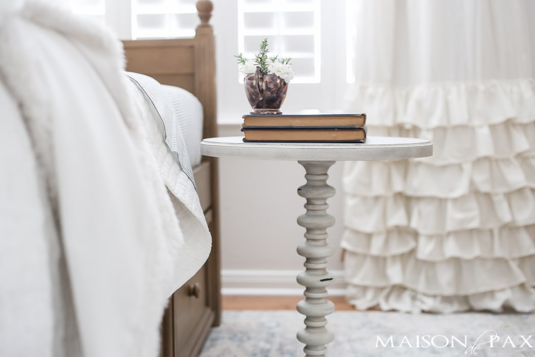 Elegant, neutral little girl room with wood tones and a stenciled accent wall: A gray-washed trundle bed provides the perfect anchor for a gorgeous, neutral yet feminine little girl's room.