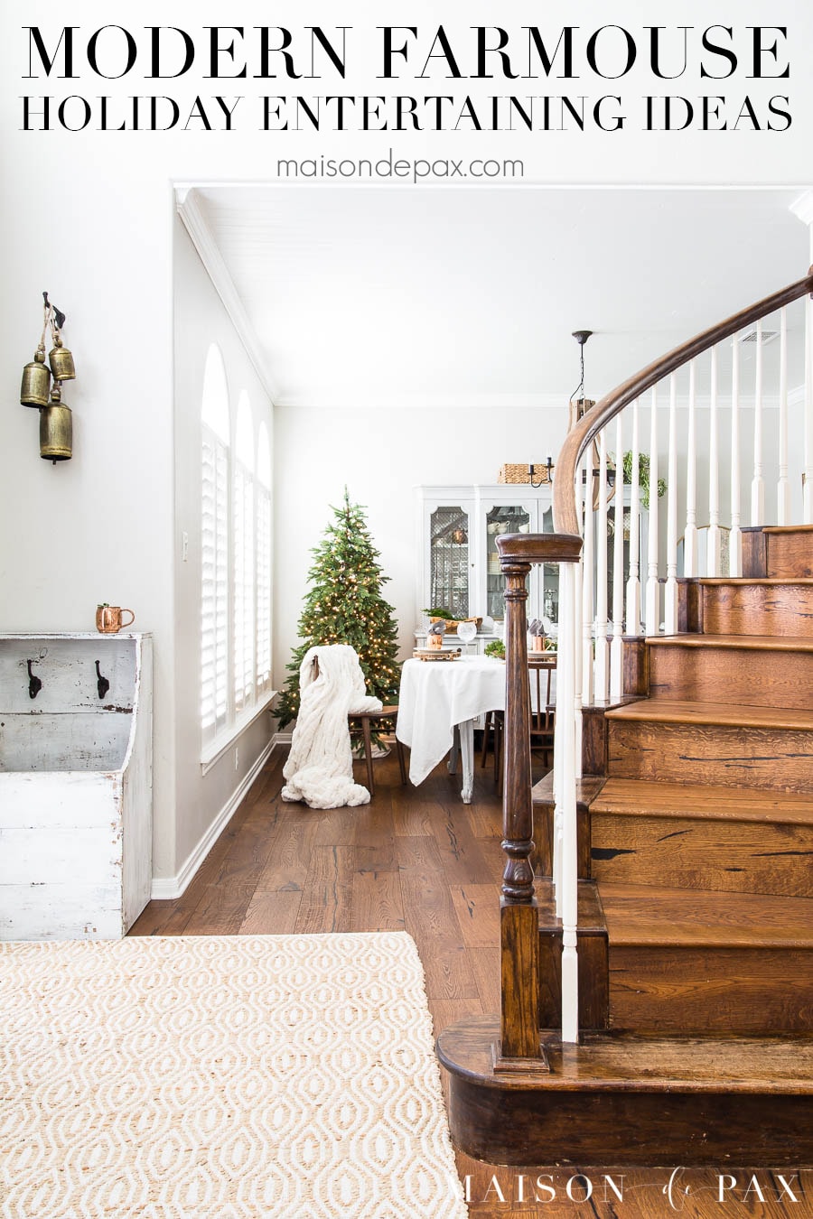 view of wooden staircase and dining room beyond with Christmas tree and text overlay that reads "modern farmhouse holiday entertaining ideas"