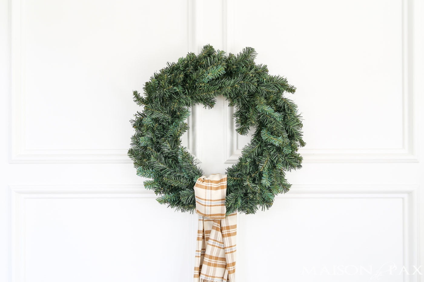 tie a plaid scarf onto a cheap wreath to great a gorgeous, expensive look (and click for 4 other easy, affordable wreath ideas!) #christmaswreath