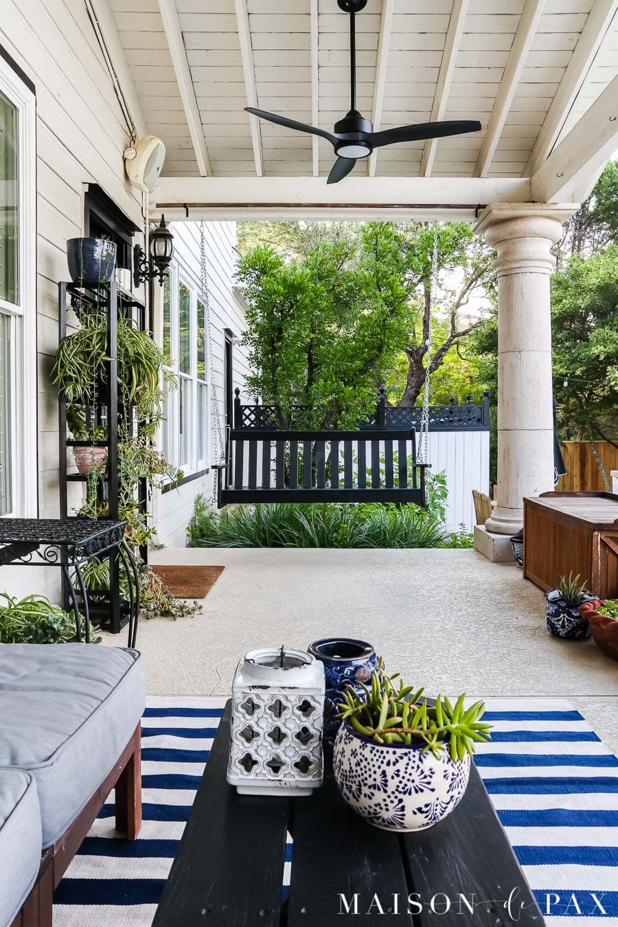 white vaulted porch ceiling with black outdoor fans