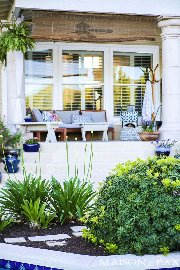 Texas Hill Country Portico with outdoor furniture and landscaped yard- Maison de Pax