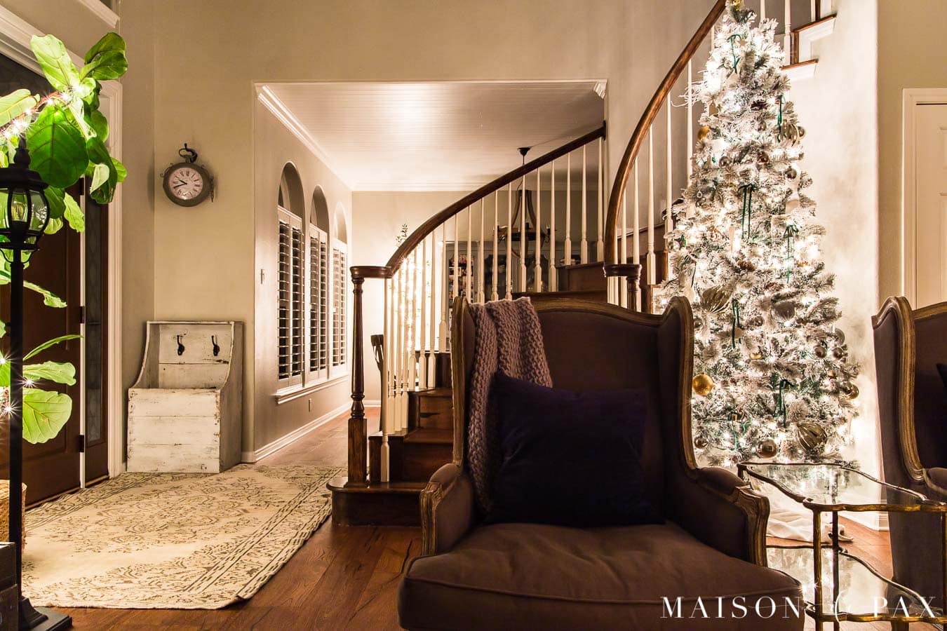 entryway and stairwell with Christmas lights | Maison de Pax