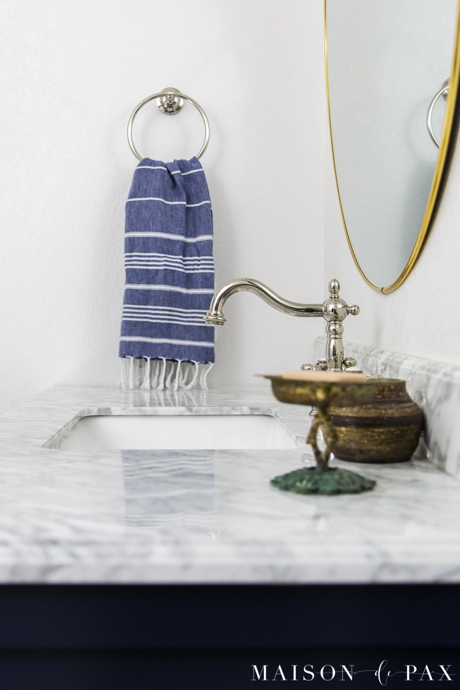 polished nickel classic sink faucet with marble top vanity