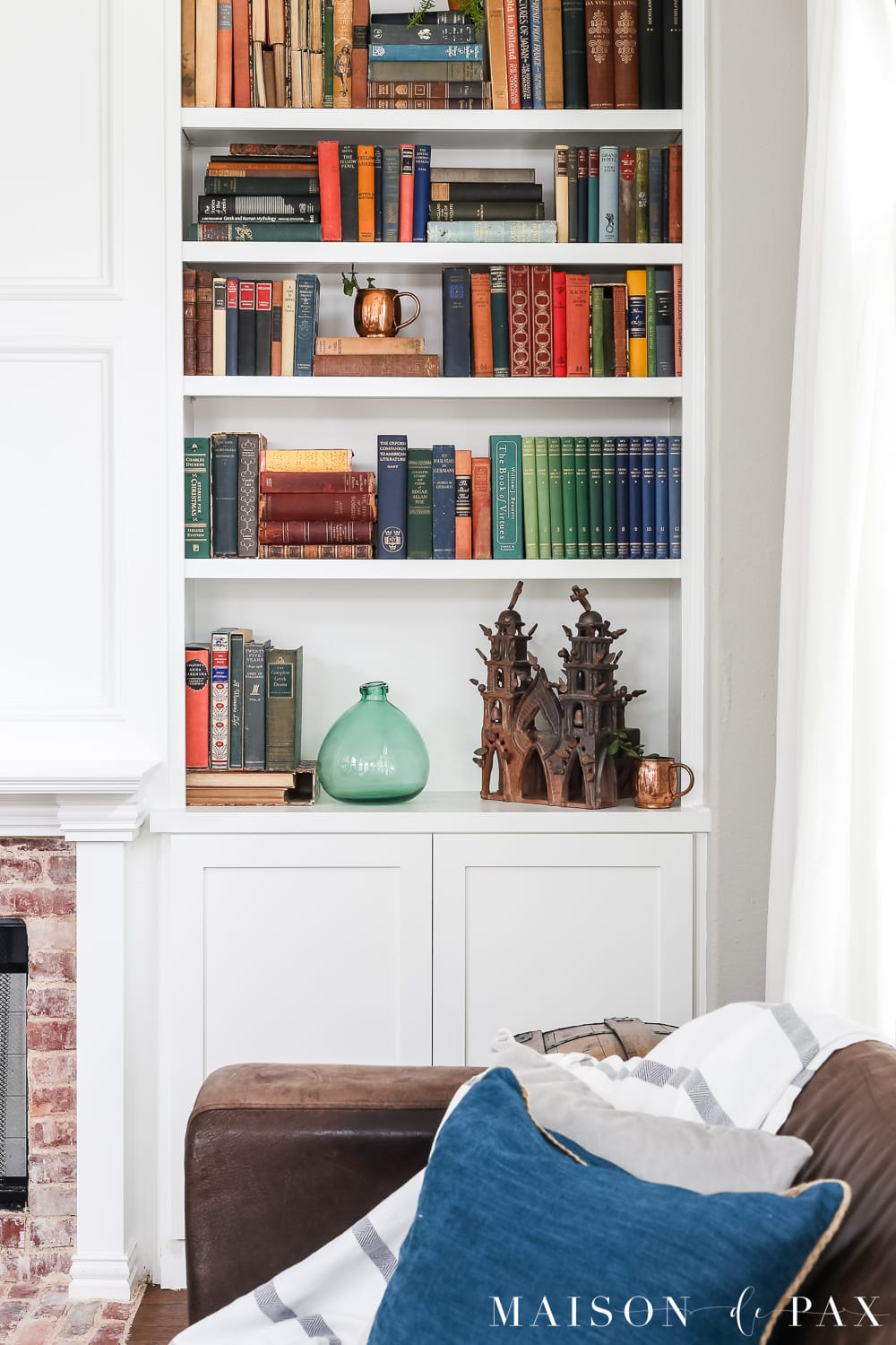 colorful antique books on a bookcase - Maison de Pax