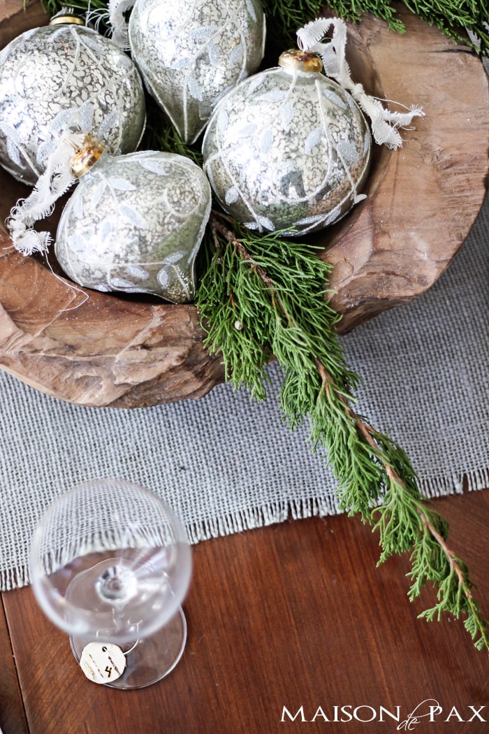 Winter table centerpiece with mercury glass ornaments and greenery in a wooden bowl | aiweb9ygdry.cmersite.com
