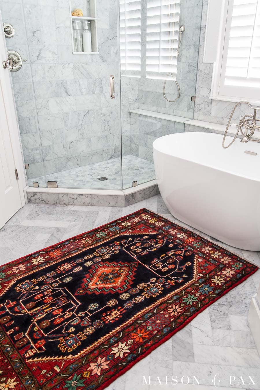 marble herringbone floor and freestanding tub | Maison de Pax