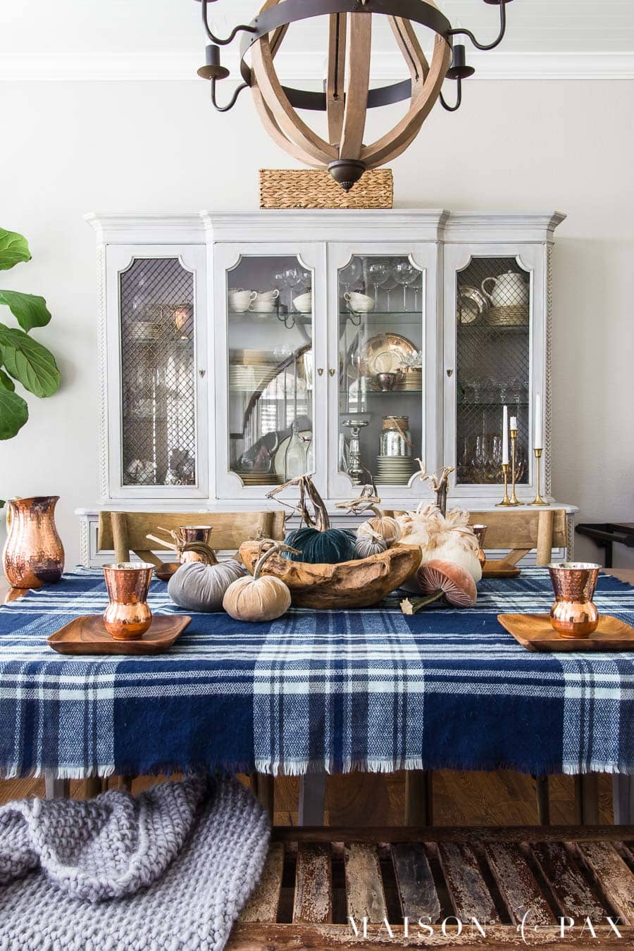 Get ideas for non-traditional fall decorating with this blue velvet pumpkin centerpiece! #velvetpumpkins #falltable #bluefalldecor #falldecorating #falldecor #tablescape #plaid #pumpkincenterpiece