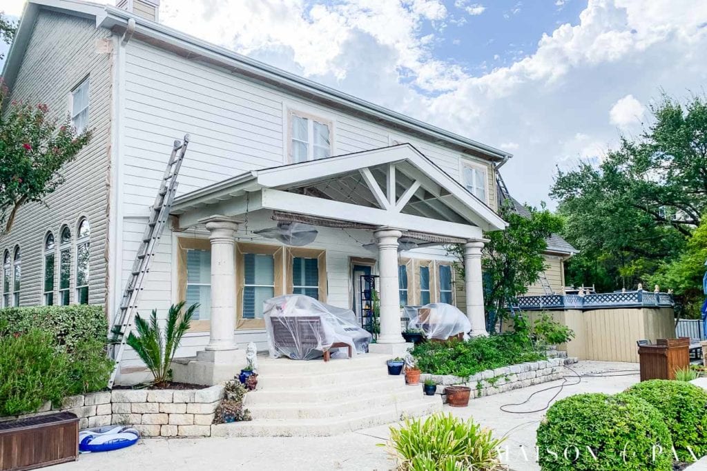 creamy brick home in the process of being painted | Maison de Pax