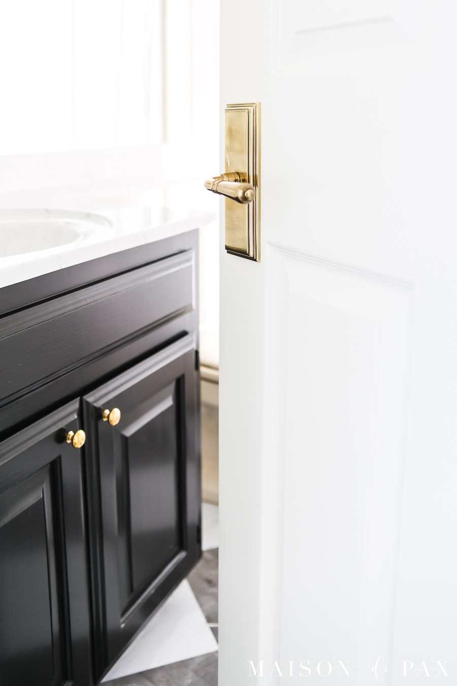 elegant brass door knob with backplate on 6 panel door
