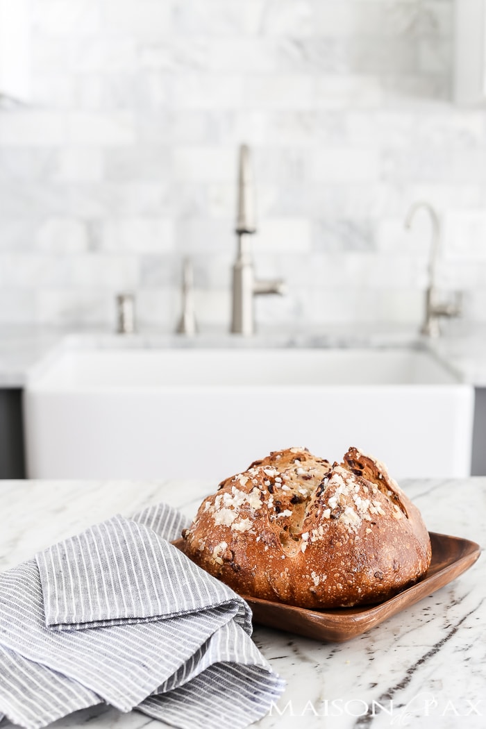 marble kitchen with warm, fresh loaf of bread #marblekitchen