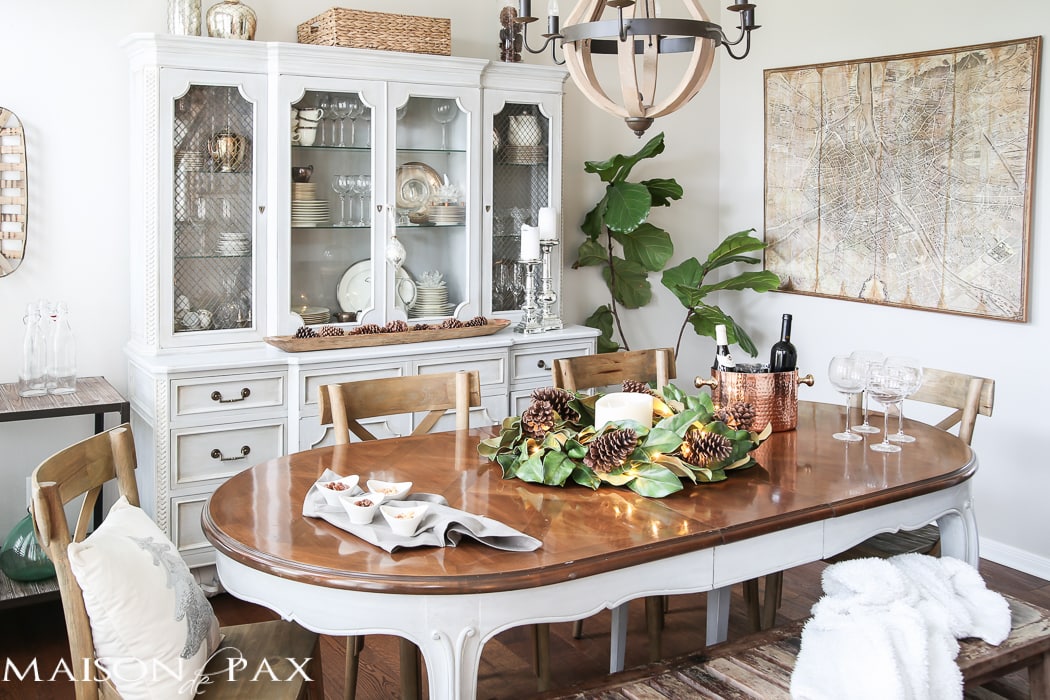 simple greenery and mercury glass makes this French farmhouse style dining room all set for Christmas!