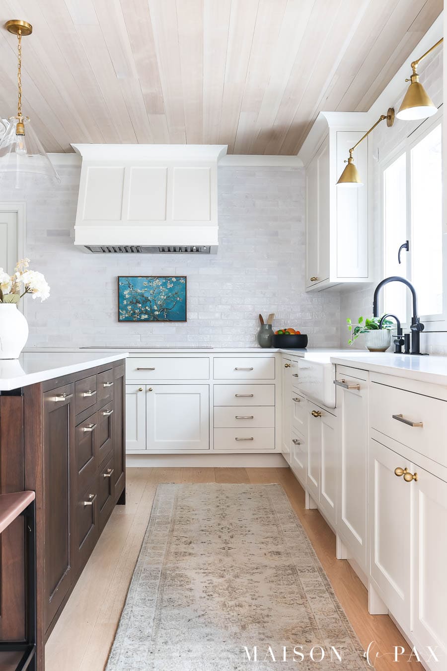 hand knotted kitchen runner in white kitchen with wood island