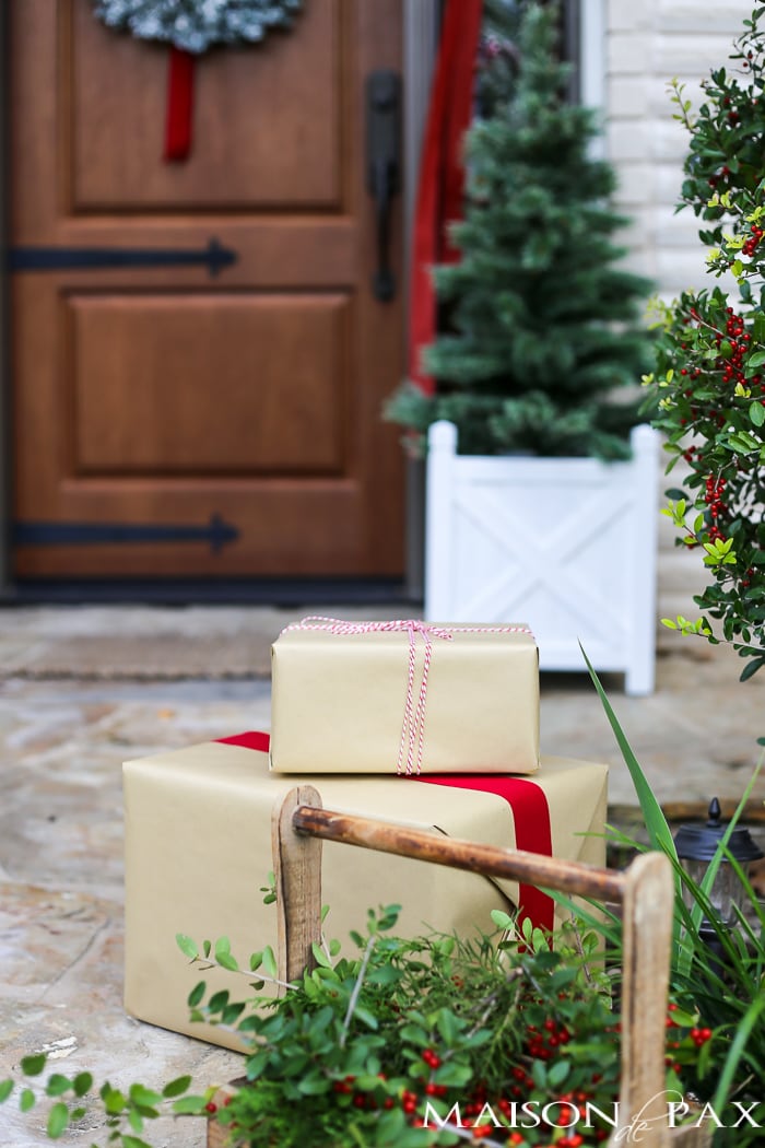 Greenery and Red Holiday Front Porch: What a beautiful, classic look! Get Christmas front porch decorating ideas here!