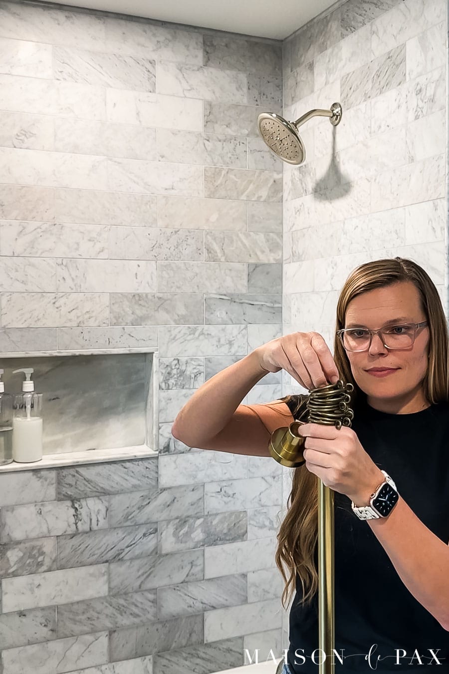 installing curtain rings onto shower curtain rod