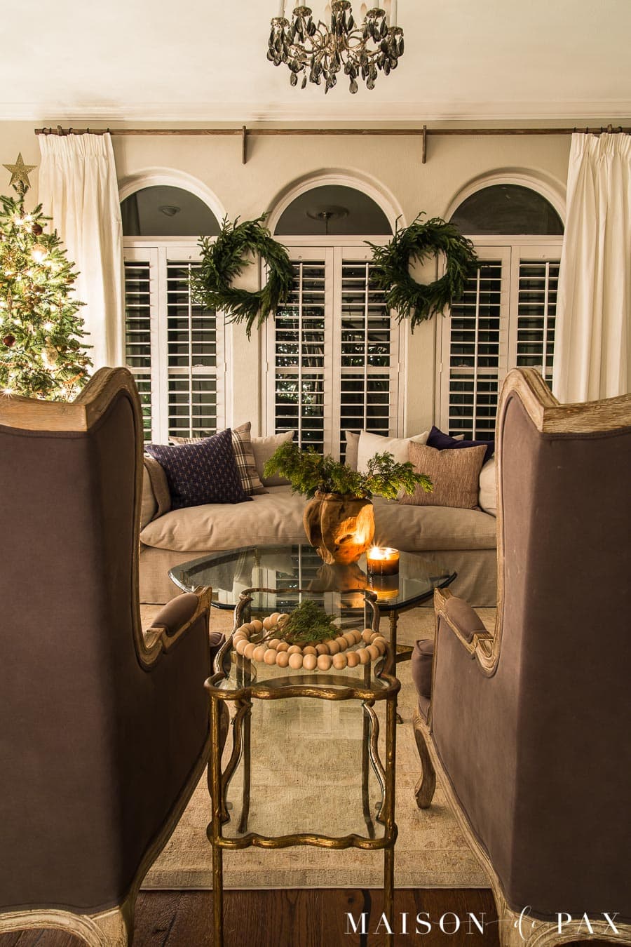 cedar clippings and candles decorate for the holidays
